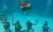 Underwater Flag hoisting by Atoll Scuba Team of UT of