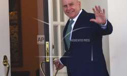 National security adviser HR McMaster waves as he walks