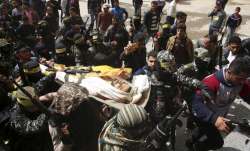 Fateh masked militants carry the body of Hamdan Abu Amsha,