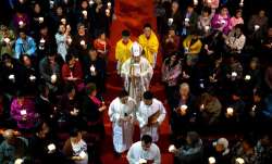   Chinese Bishop Joseph Li Shan, center, walks down the