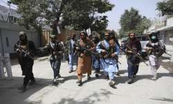 Taliban fighters patrol in the Wazir Akbar Khan