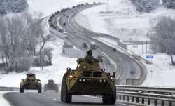 A convoy of Russian armored vehicles moves along a highway