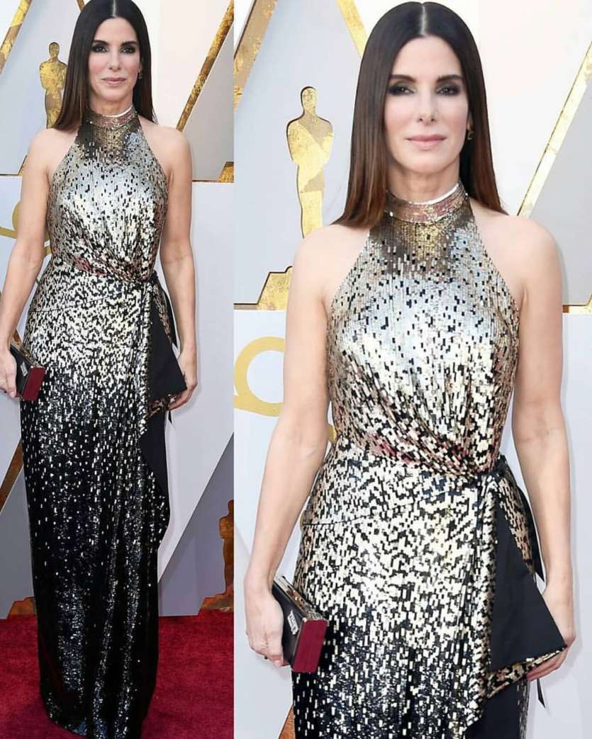 Sandra Bullock is another actress to forward the league of metallic gowns this Oscars red carpet. She made a comeback at Oscars after a break of 4 years. She wore a gold sequin halter dress from Louis Vuitton. 